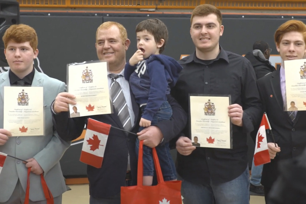 Hussein and his family getting their citizenship